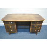 A MID CENTURY TEAK DESK, possibly Morris of Glasgow, bow front and back top, over six drawers, width