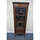 AN EDWARDIAN MAHOGANY AND MARQUETRY INLAID ASTRAGAL GLAZED SINGLE DOOR CORNER CUPBOARD, enclosing