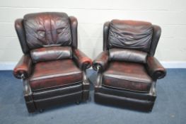 TWO OXBLOOD LEATHER ARMCHAIRS, one chair manual reclining, width of outer arm 91cm (condition:-