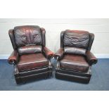 TWO OXBLOOD LEATHER ARMCHAIRS, one chair manual reclining, width of outer arm 91cm (condition:-