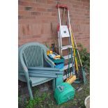 A SELECTION OF GARDEN ITEMS to include a plastic circular garden table with two chairs, a metal four