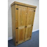 A MODERN CORONA PINE DOUBLE WARDROBE, width 104cm x depth 58cm x height 189cm (condition:- surface