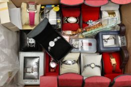 A BOX OF ASSORTED FASHION WRISTWATCHES, mostly ladys quartz watches, various styles, some with