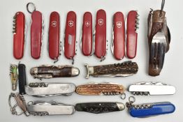 AN ASSORTMENT OF SWISS ARMY KNIVES, twenty knives, predominantly 'Victorinox', (condition report: