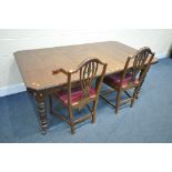 AN EDWARDIAN MAHOGANY WIND OUT DINING TABLE, with two additional leaves, extended length width, open