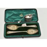 A PAIR OF CASED GEORGE III SILVER BERRY SPOONS AND AN EDWARDIAN SILVER MUSTARD POT, the pair of
