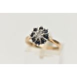 A 9CT GOLD SAPPHIRE AND DIAMOND CLUSTER RING, centring on a single cut diamond illusion set, in a