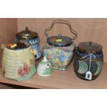 FOUR CERAMIC BISCUIT BARRELS, comprising a Royal Doulton Lambeth Ware barrel decorated with a