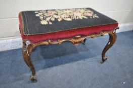 A VICTORIAN ROSEWOOD FOOTSTOOL, with a needlework top, on cabriole legs, width 82cm x depth 48cm x