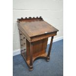 A REGENCY MAHOGANY DAVENPORT, the sloped top with a leather writing surface, enclosing a fitted