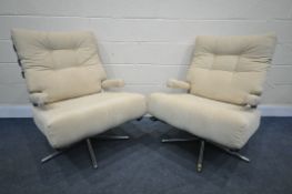 A PAIR OF MID CENTURY CHROME FRAMED SWIVEL CHAIRS, with rubber and open arm rest with later loose