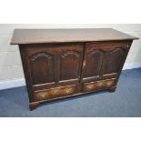 A GEORGIAN OAK CONVERTED MULE CHEST, with a double fielded panel doors over two drawers on bracket