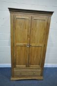 A SOLID OAK WARDROBE, with two doors over two drawers , width 93cm x depth 60cm x height 181cm (