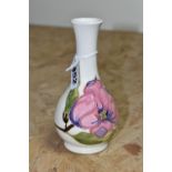 A MOORCROFT POTTERY MAGNOLIA VASE, of bottle form, decorated with tube lined pink Magnolia pattern