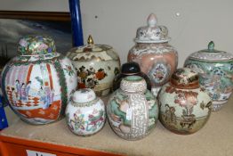 EIGHT ORIENTAL GINGER JARS AND COVERED VASES, to include a famille rose ginger jar, two Satsuma