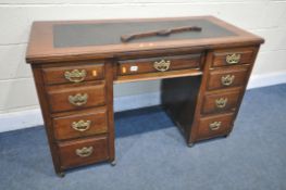 AN EDWARDIAN WALNUT KNEE HOLE DESK, with a later black finish writing surface and 9 draws on later