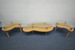 A PAIR OF MODERN BEECH AND GLASS YIN YANG SHAPED SIDE TABLES, along with a similar coffee table,