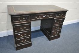 A MAHOGANY PEDESTAL DESK, with a green leather writing surface and an arrangement of 8 drawers,