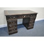 A MAHOGANY PEDESTAL DESK, with a green leather writing surface and an arrangement of 8 drawers,