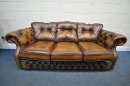 A BROWN LEATHER CHESTERFIELD SOFA, length 201cm (condition:-good condition)
