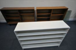 A PAIR OF MID CENTURY MINTY TEAK BOOKCASES, with glass sliding doors, width 136cm x depth 29cm x