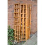 A COLLECTION OF TRELLIS comprising six lengths of wooden trellis along with six lengths of wood (