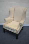 20TH CENTURY GEORGIAN STYLE WING BACK ARMCHAIR, with cream fabric