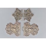 TWO SILVER NURSES BELT BUCKLES, the first a large openwork floral and Bacchus buckle, hallmarked '