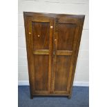 AN EARLY 20TH CENTURY OAK DOUBLE DOOR WARDROBE, width 92cm x depth 39cm x height 173cm, (condition:-