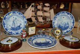 A GROUP OF NAUTICAL CLOCKS AND WALL PLATES, comprising a Kevin Hughes ship's wall cock and