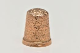 A 9CT GOLD THIMBLE, floral pattern, hallmarked 9ct Birmingham, approximate gross weight 4.6 grams