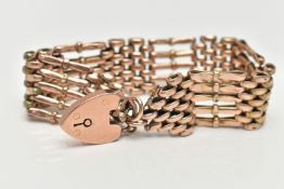 A ROSE METAL GATE BRACELET, wide five bar bracelet, approximate width 19.4mm, fitted with a heart