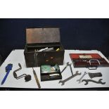 A VINTAGE METAL TOOLBOX containing some tools, spanners, chisels, hand drill, Stillson's, files