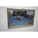 A LARGE GILT FRAMED BEVELLED EDGE WALL MIRROR, 137cm x 86cm