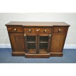 A REPRODUCTION REGENCY STYLE BREAKFRONT SIDEBOARD, with three drawers and four cupboard doors, two