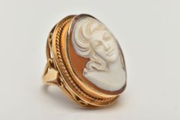 A LARGE 9CT GOLD CAMEO DRESS RING, oval shell cameo depicting a lady, collet set with a fine rope