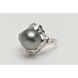 A WHITE METAL THAITIAN PEARL AND DIAMOND DRESS RING, large silver grey pearl, measuring