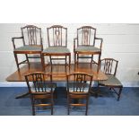 A REGENCY STYLE MAHOGANY TWIN PEDESTAL DINING TABLE, with an additional leaf, extended length