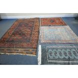 THREE ANTIQUE EASTERN PERSIAN WOOLLEN RUGS, of various patterns and colours, largest rug