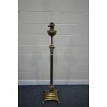 A 19TH CENTURY BRASS TELESCOPIC OIL LAMP, with a glass funnel and reservoir on a Corinthian column