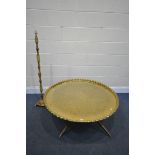 A LARGE ANGLO INDIAN BRASS TOP COFFEE TABLE, decorated with foliate detail surrounded by moulded