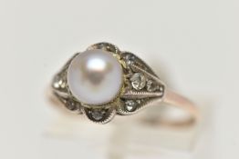 A CULTURED BAROQUE PEARL RING, pearl measuring approximately 6.5mm, in a surround of colourless