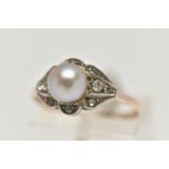 A CULTURED BAROQUE PEARL RING, pearl measuring approximately 6.5mm, in a surround of colourless