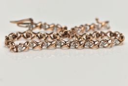 A 9CT GOLD LINE BRACELET, a rose gold cross link bracelet, interspaced with round brilliant cut
