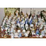 A QUANTITY OF DECORATIVE CERAMIC AND GLASS BELLS, to include a set of twelve Danbury Mint Fairy tale