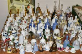 A QUANTITY OF DECORATIVE CERAMIC AND GLASS BELLS, to include a set of twelve Danbury Mint Fairy tale