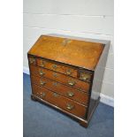 A GEORGIAN OAK BUREAU, with a fitted interior over six exterior drawers on bracket feet, width