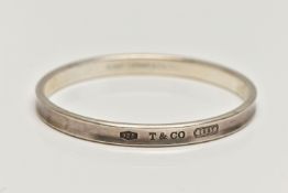A 'TIFFANY & CO' BANGLE, concaved bangle stamped '925 T&Co 1837', signed to the interior of the band