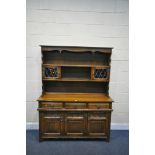 AN OLD CHARM OAK DRESSER, with three draws over three linenfold cupboard doors, width 135cm x