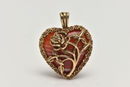 A 9CT GOLD BANDED AGATE HEART PENDANT, polished orange and white agate heart within a floral